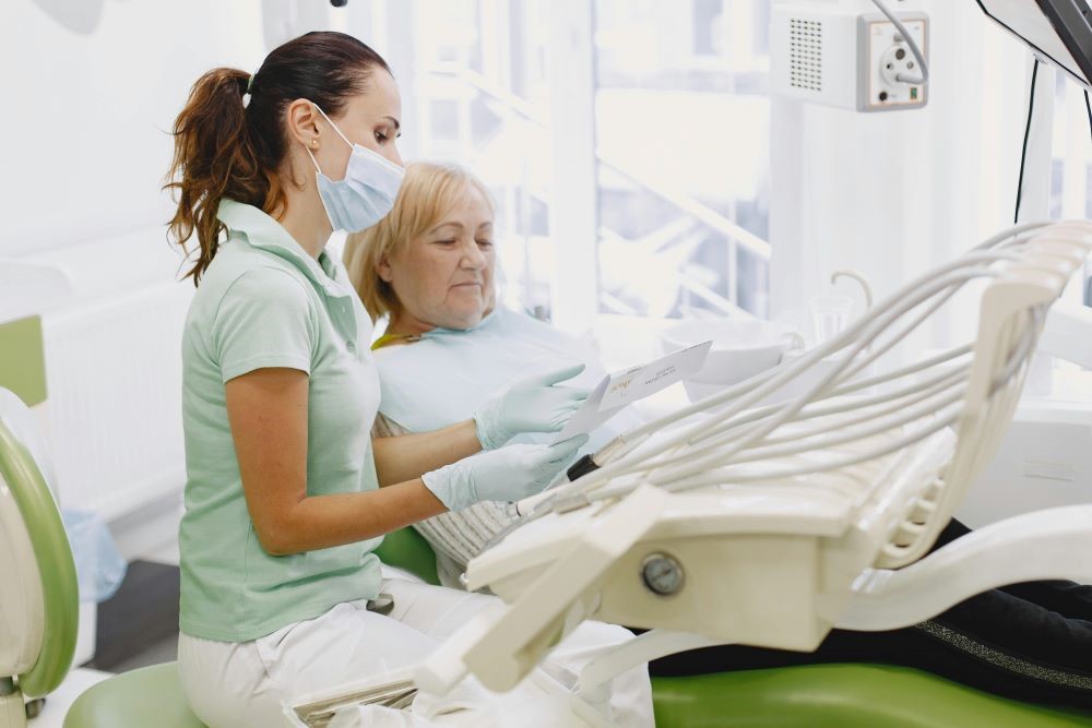 Dental hygienist explaining Canadian Dental Care Plan CDCP coverage and treatment options to a patient during a consultation at North Star Dentistry in Mississauga