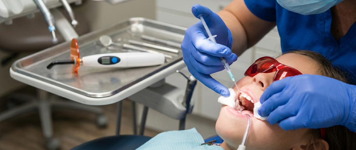 Dental sealant application on a child's molar at North Star Dentistry in Mississauga — hygienist applying protective resin coating to prevent cavities