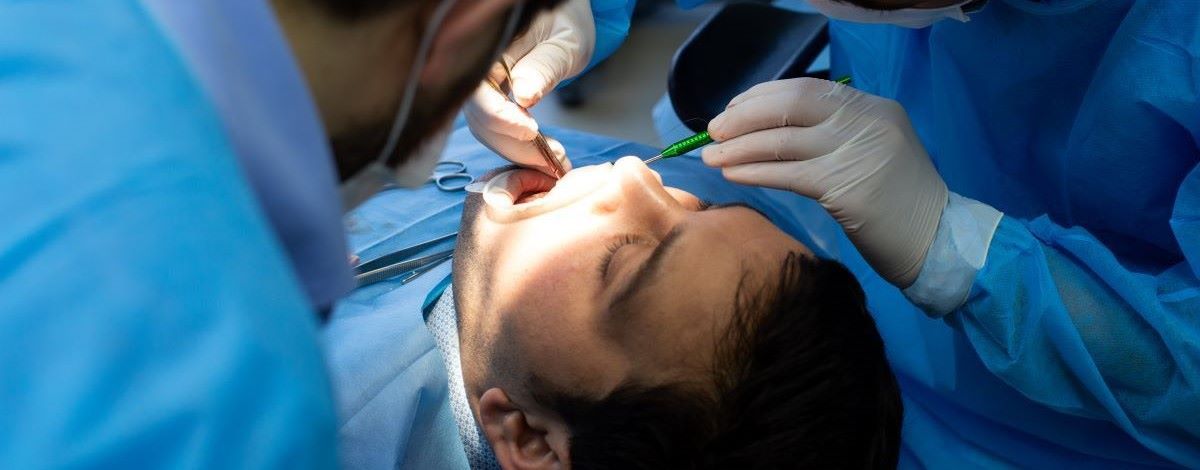 Oral surgery procedure at North Star Dentistry in Mississauga — complex extraction, bone grafting, and gum reshaping performed by experienced dental professionals